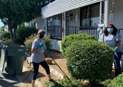 Volunteers raking debris