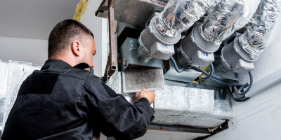 Man repairing ducts